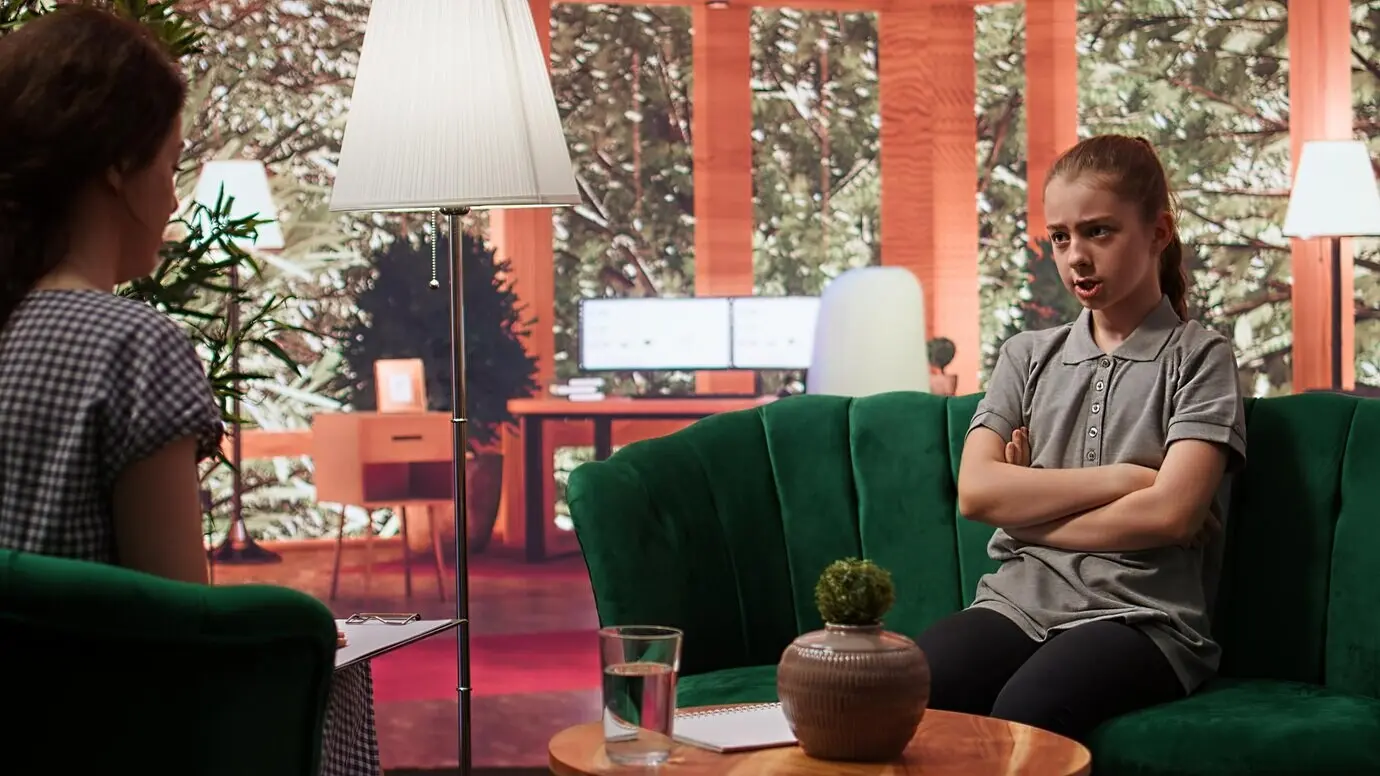 A teenager in a counseling session focused on managing emotions and self-esteem issues.